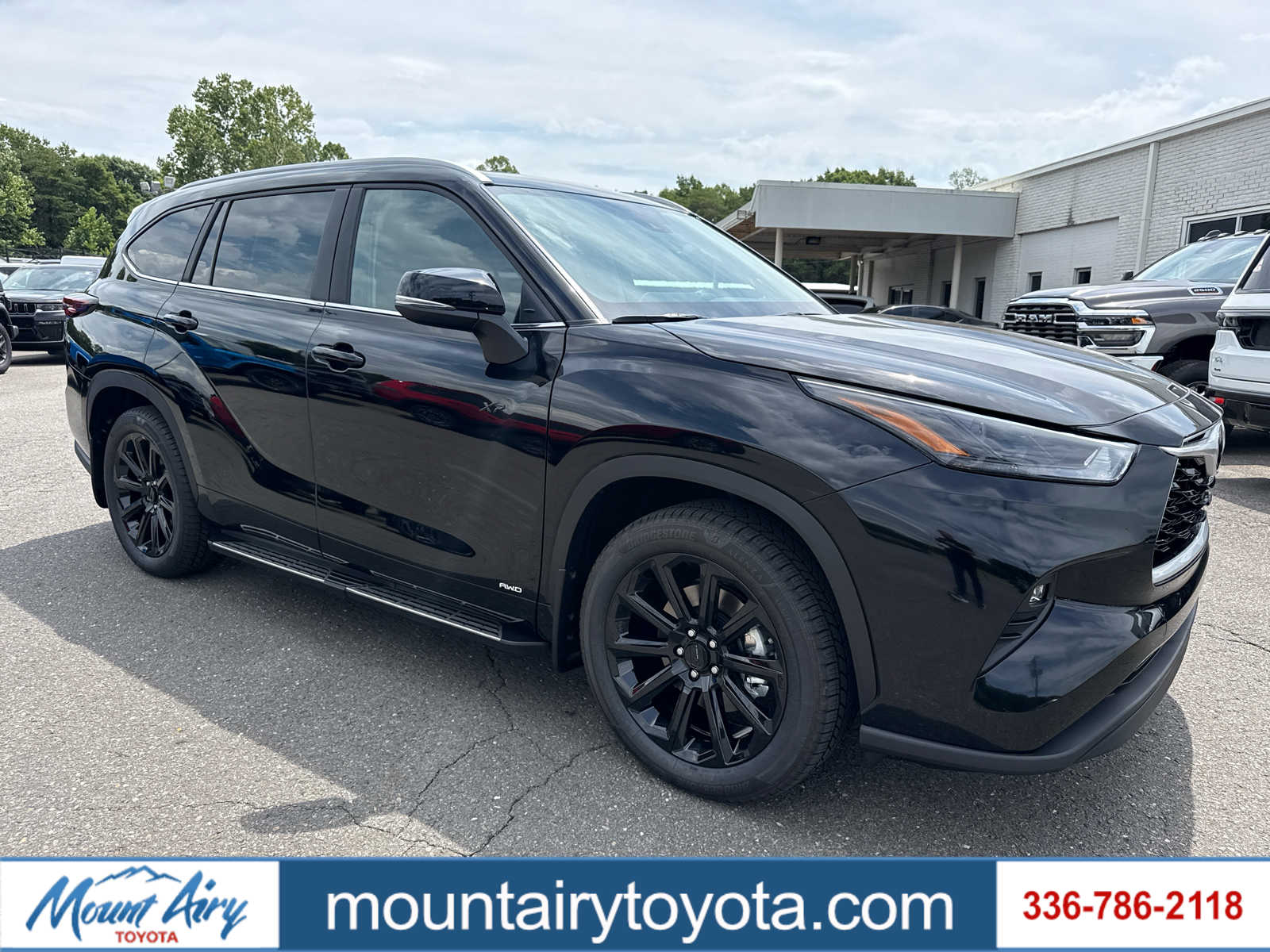Midnight Black Metallic 2026 Toyota Highlander Hybrid SUV / Crossover All-Wheel Drive Continuously Variable Transmission