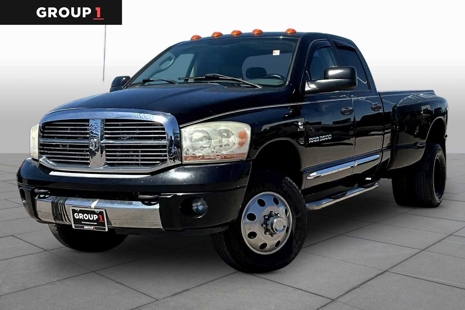 Black 2006 Dodge RAM 3500 Laramie Quad Cab LB DRW 4WD Pickup Truck Four-Wheel Drive Manual