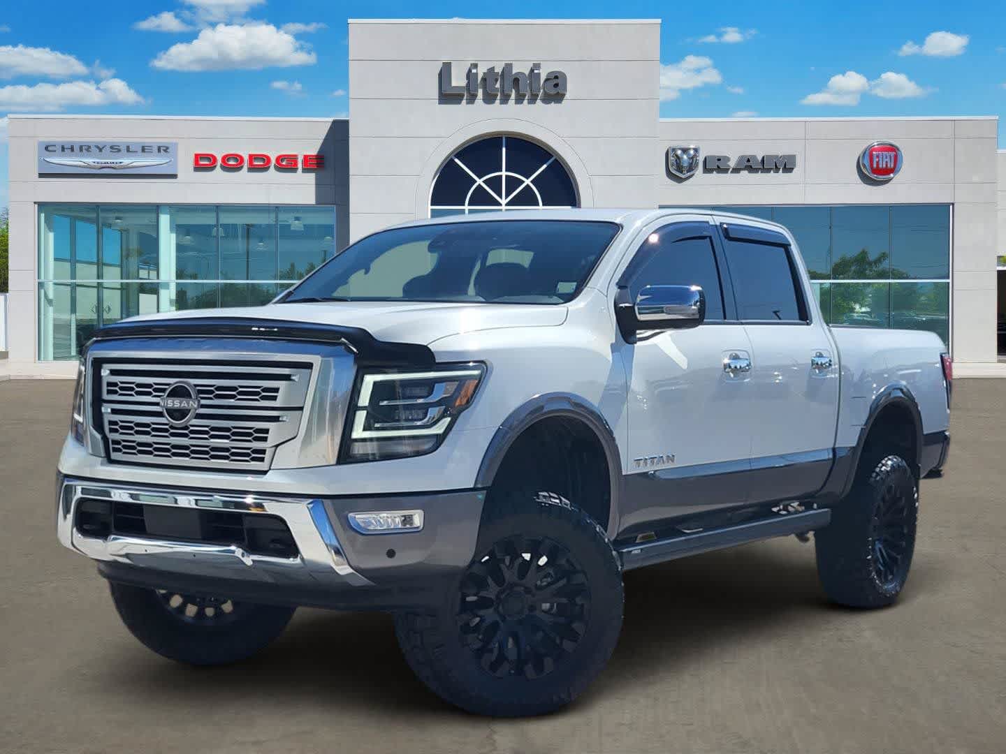 Pearl White 2023 Nissan Titan Pickup Truck Four-Wheel Drive 9-Speed Automatic