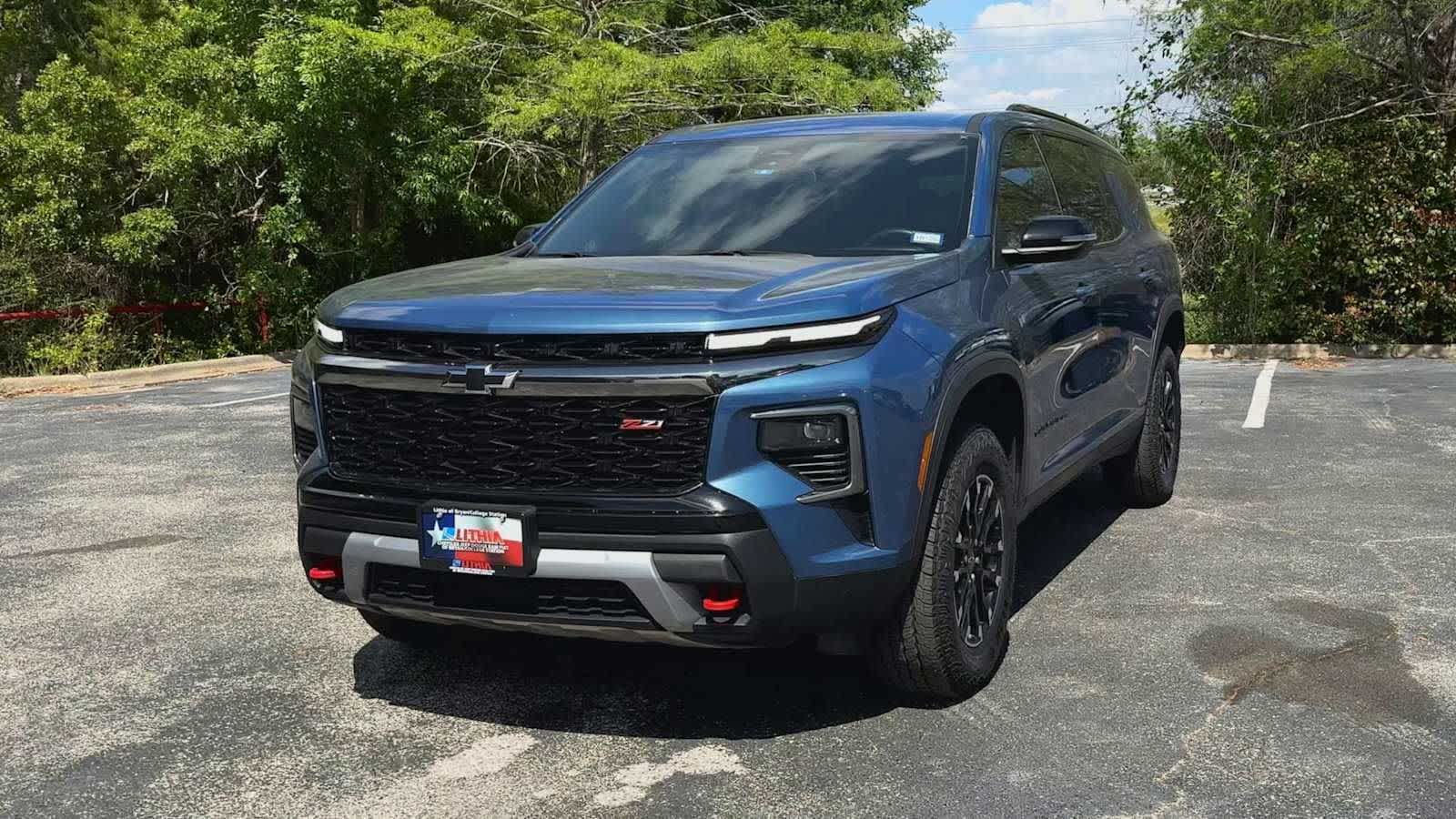 View vehicle photo 3