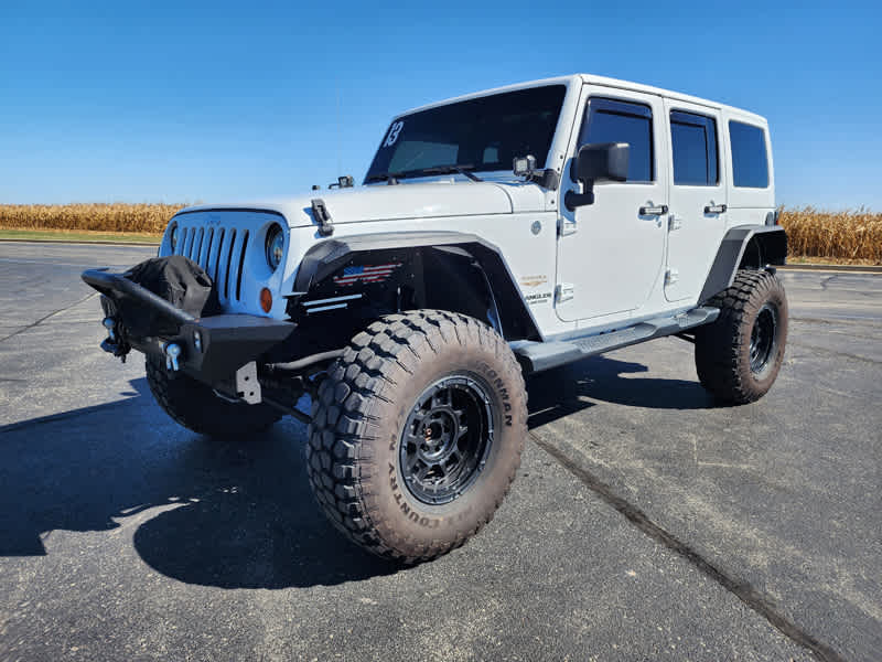 Used 2013 Jeep Wrangler Unlimited Sahara with VIN 1C4BJWEG9DL629131 for sale in Gilman, IL