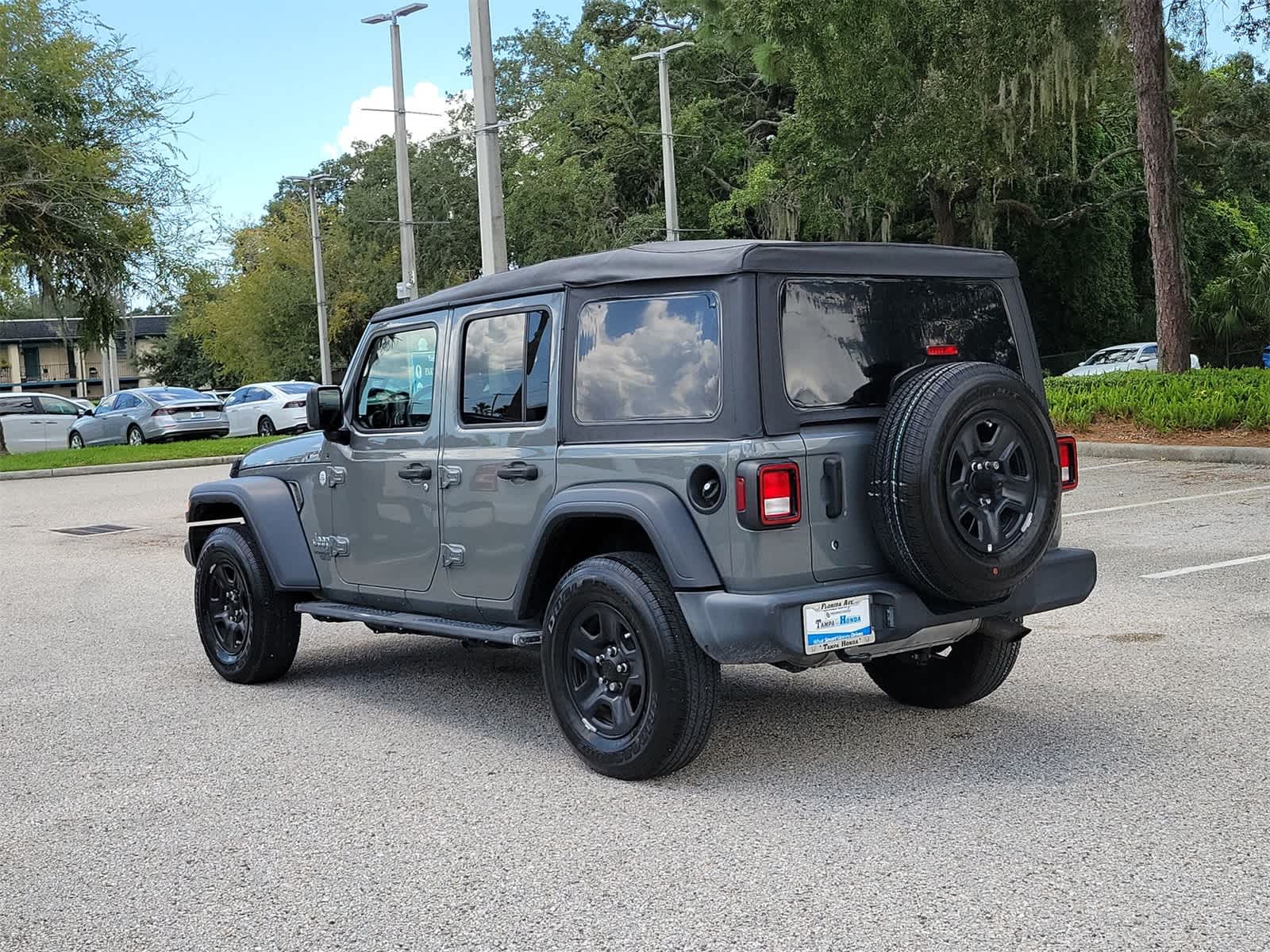 Used 2021 Jeep Wrangler Unlimited Sport with VIN 1C4HJXDN0MW622499 for sale in Tampa, FL