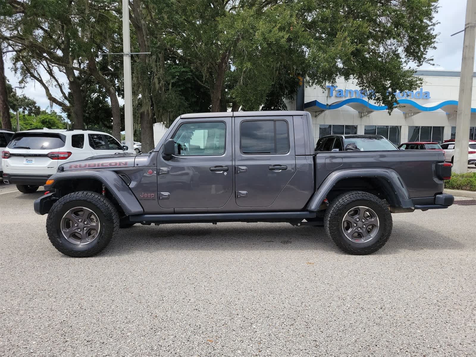 Used 2021 Jeep Gladiator Rubicon with VIN 1C6JJTBG7ML582526 for sale in Tampa, FL