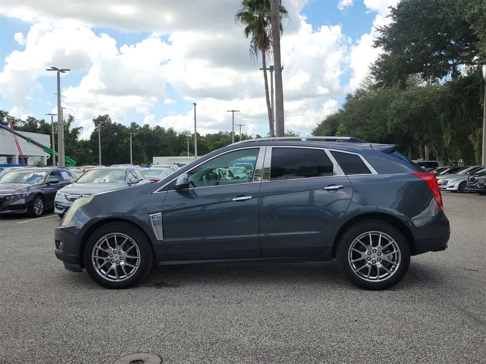 Used 2013 Cadillac SRX Premium Collection with VIN 3GYFNJE38DS584323 for sale in Tampa, FL