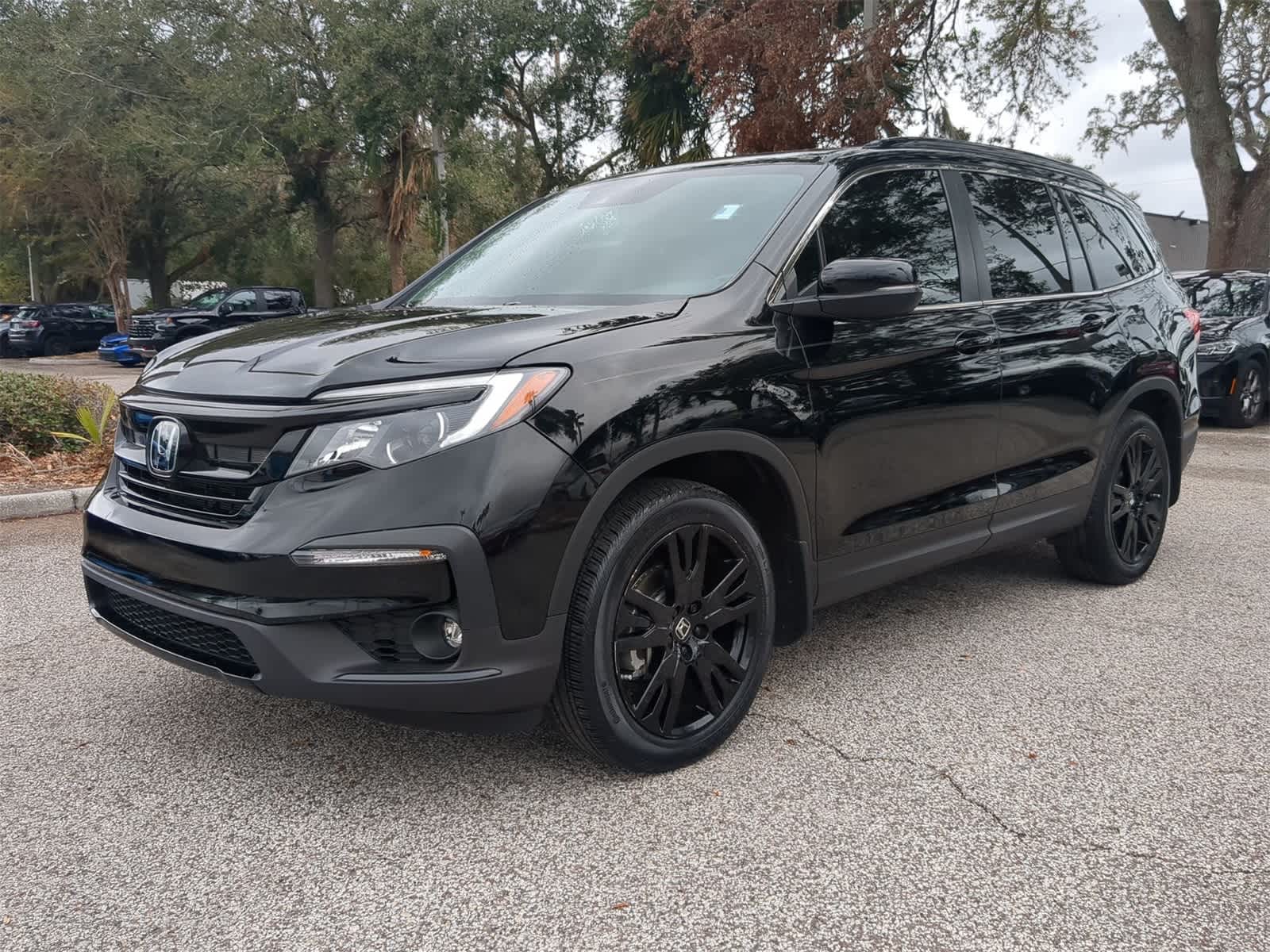 Used 2022 Honda Pilot SE with VIN 5FNYF5H2XNB021399 for sale in Tampa, FL