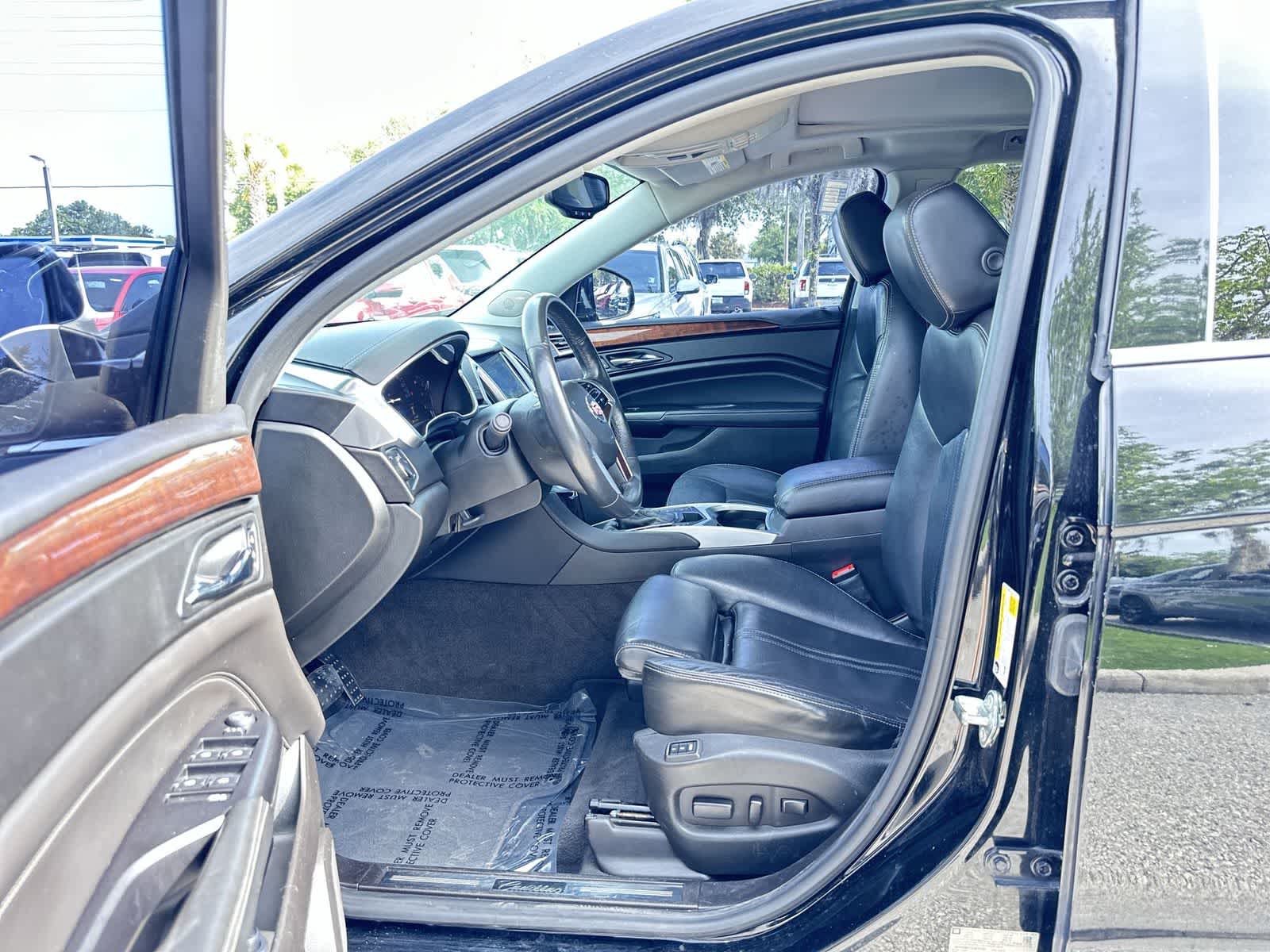 Used 2016 Cadillac SRX Luxury Collection with VIN 3GYFNBE31GS515757 for sale in Wesley Chapel, FL