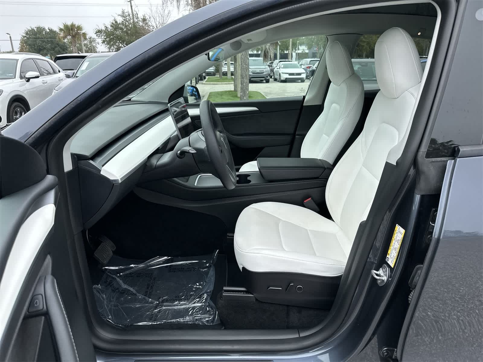 Used 2023 Tesla Model Y Long Range with VIN 7SAYGDEE2PF599203 for sale in Wesley Chapel, FL