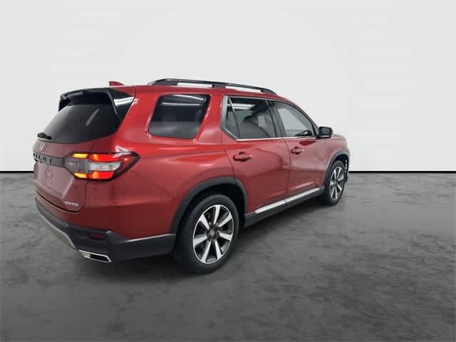 2025 Honda Pilot Touring Radiant Red Metallic II at Honda of Clear Lake