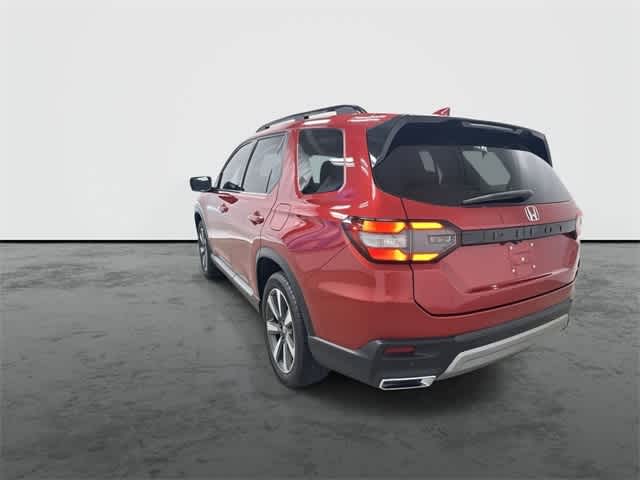 2025 Honda Pilot Touring Radiant Red Metallic II at Honda of Clear Lake