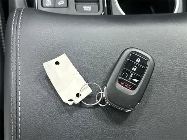 2025 Honda Pilot Touring Radiant Red Metallic II at Honda of Clear Lake