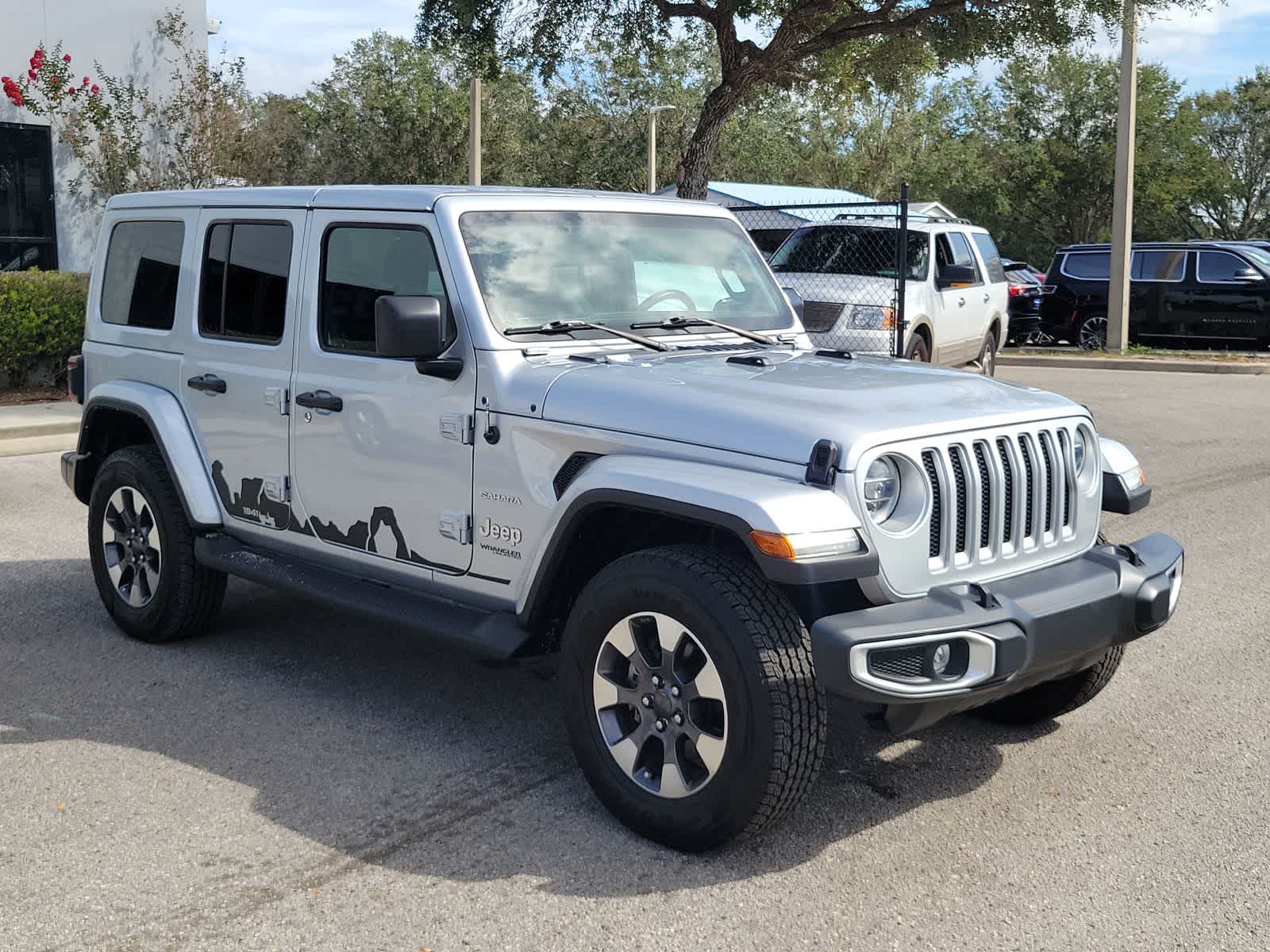 Used 2022 Jeep Wrangler Unlimited Sahara with VIN 1C4HJXEG5NW247694 for sale in Wesley Chapel, FL