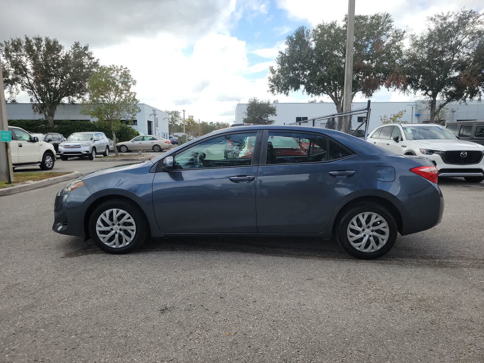 Used 2018 Toyota Corolla LE with VIN 2T1BURHE5JC034945 for sale in Wesley Chapel, FL