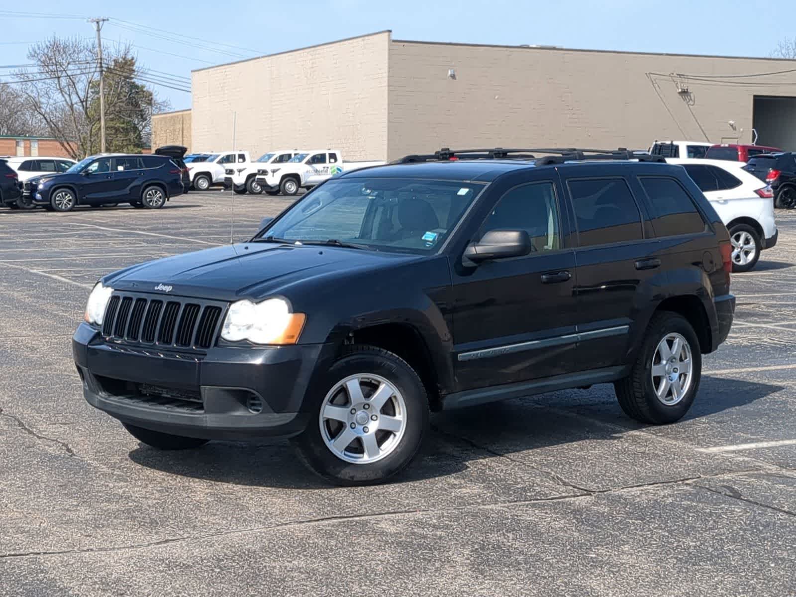 Brilliant Black Pearl 2009 Jeep Grand Cherokee Laredo 4WD SUV / Crossover Four-Wheel Drive 5-Speed Automatic