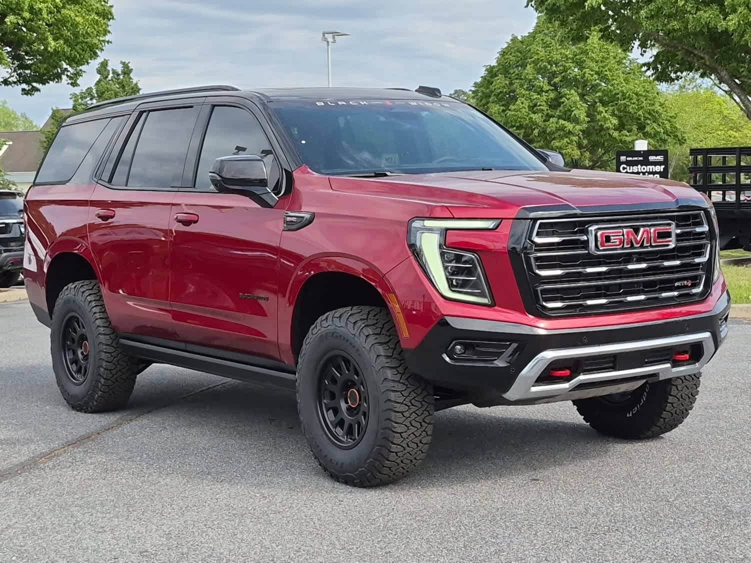 2026 GMC Yukon AT4 - VOLCANIC RED TINTCOAT exterior view 2
