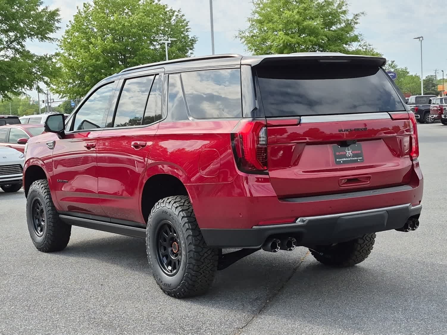 2026 GMC Yukon AT4 - VOLCANIC RED TINTCOAT exterior view 4