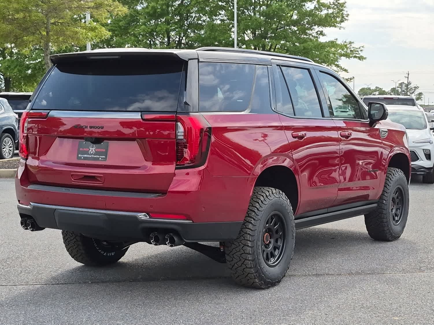 2026 GMC Yukon AT4 - VOLCANIC RED TINTCOAT exterior view 3