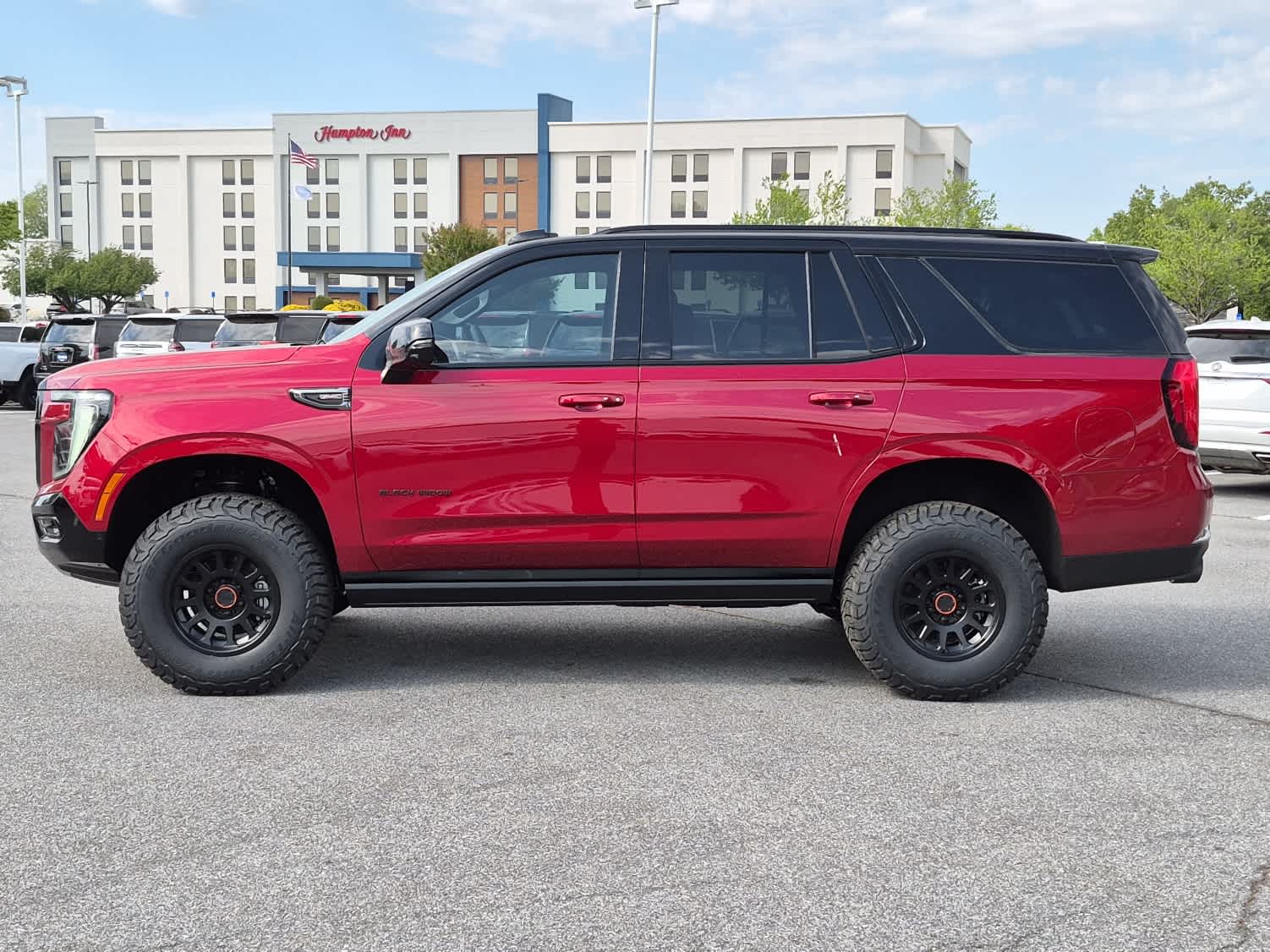 2026 GMC Yukon AT4 - VOLCANIC RED TINTCOAT exterior view 5