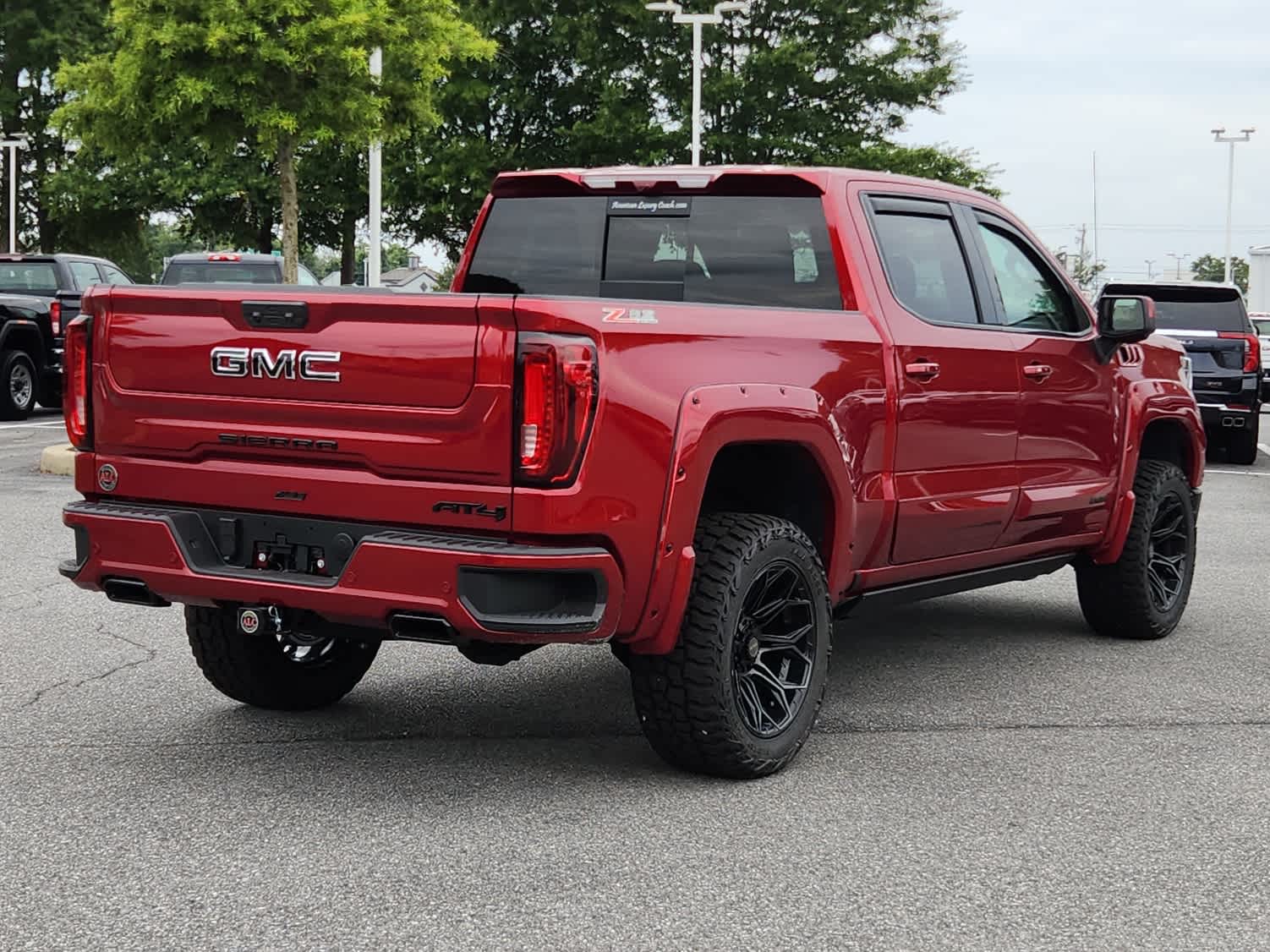 2025 GMC Sierra 1500 AT4 - Volcanic Red Tintcoat exterior view 3