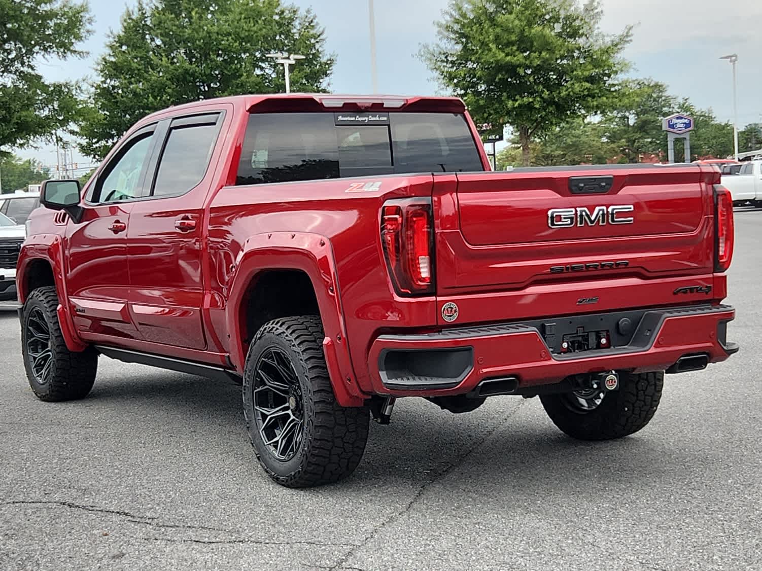 2025 GMC Sierra 1500 AT4 - Volcanic Red Tintcoat exterior view 4