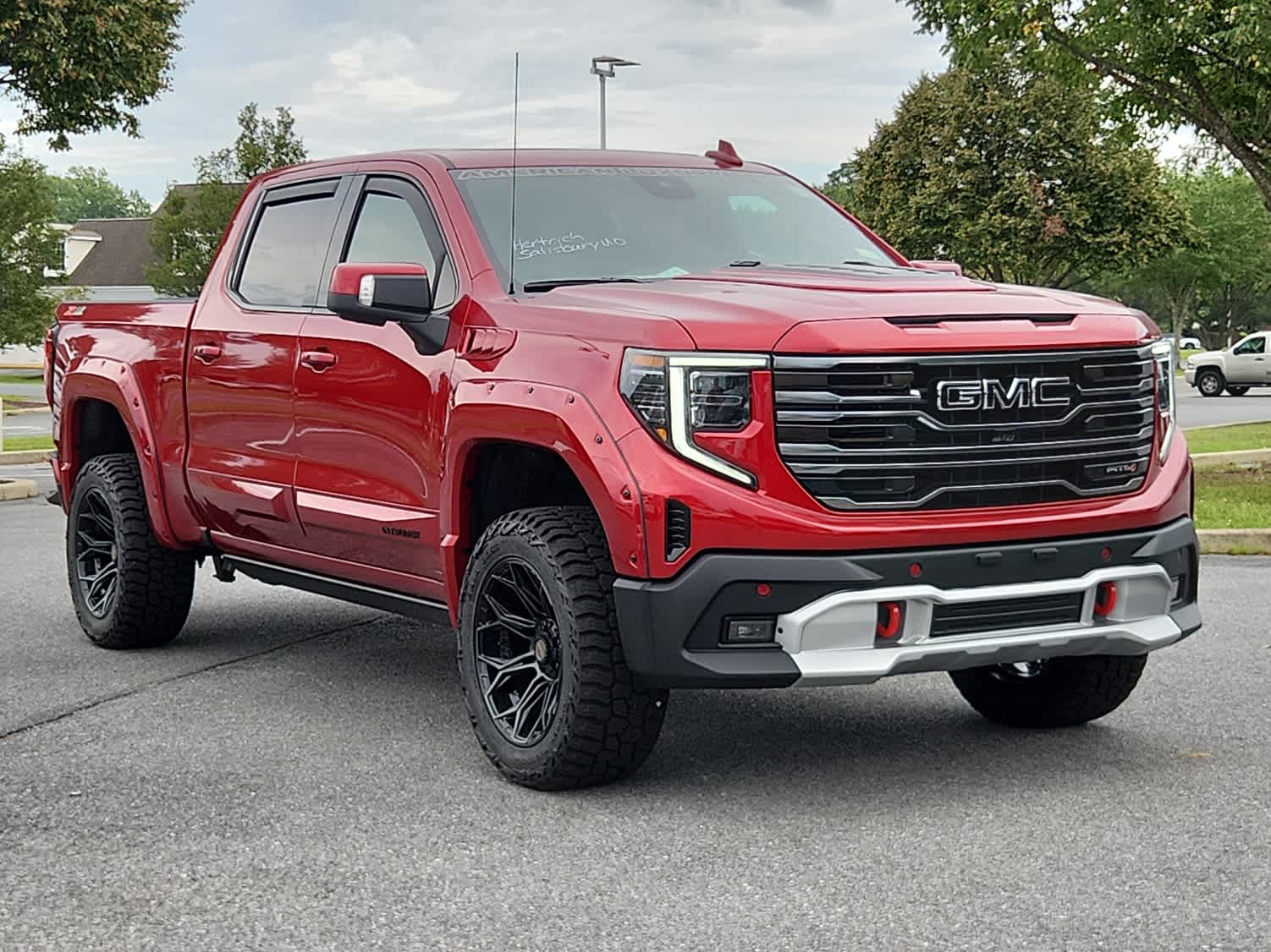 2025 GMC Sierra 1500 AT4 - Volcanic Red Tintcoat exterior view 2