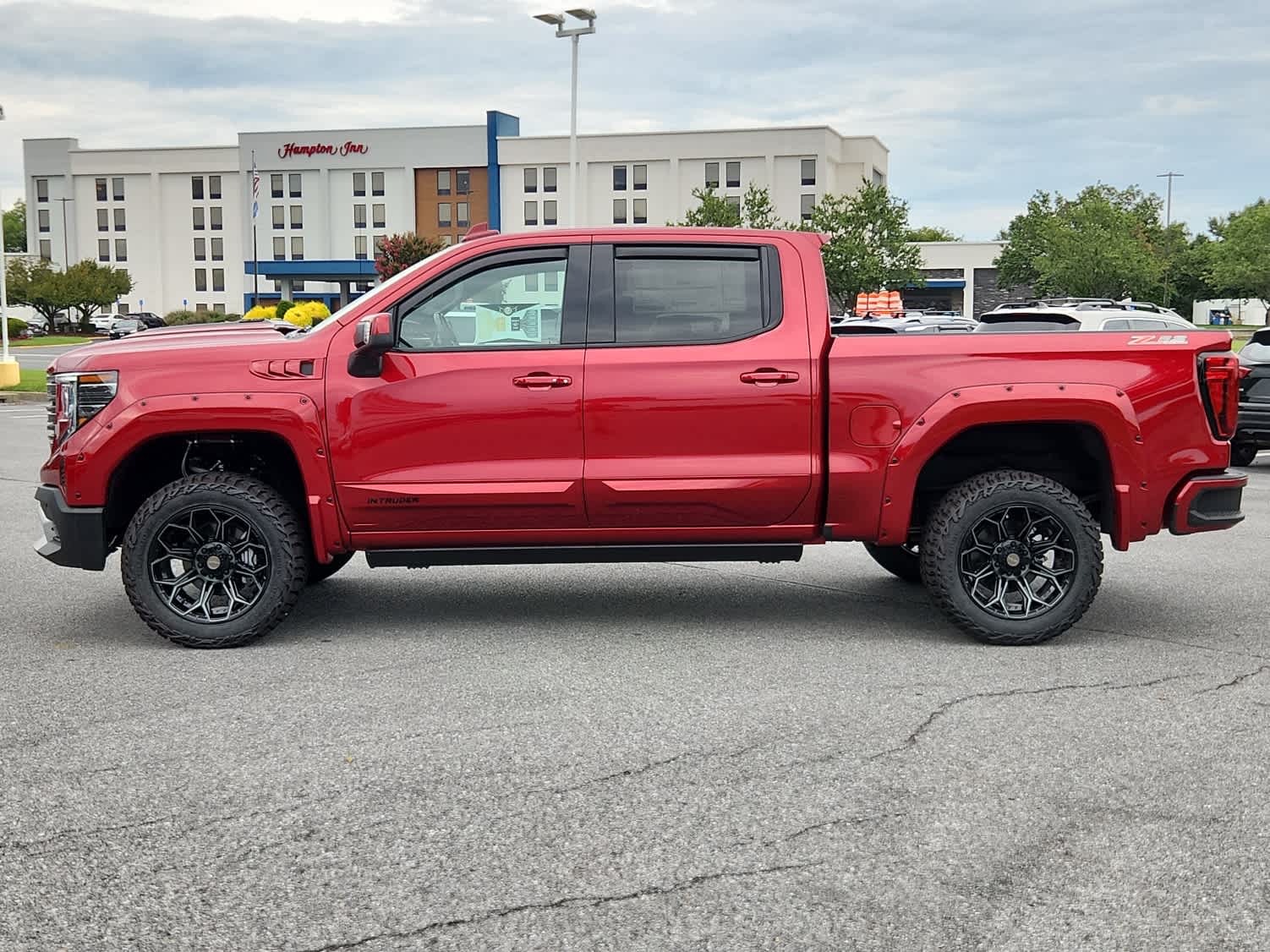 2025 GMC Sierra 1500 AT4 - Volcanic Red Tintcoat exterior view 5