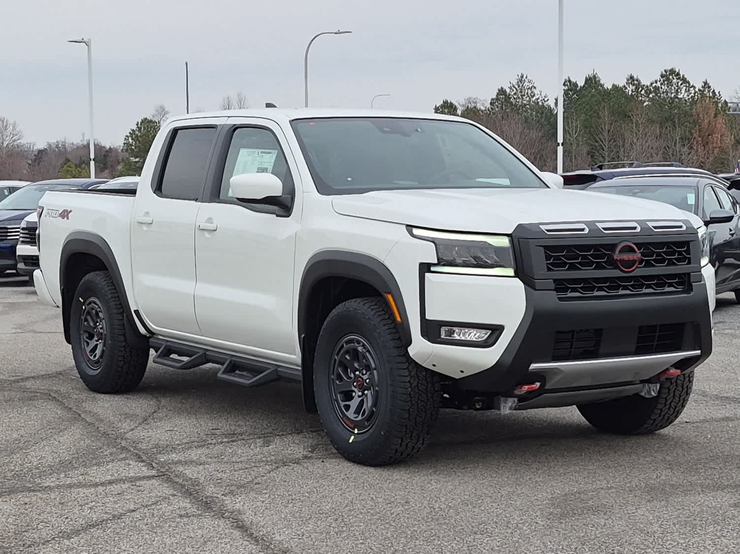 2026 Nissan Frontier PRO-4X - Glacier White exterior view 2