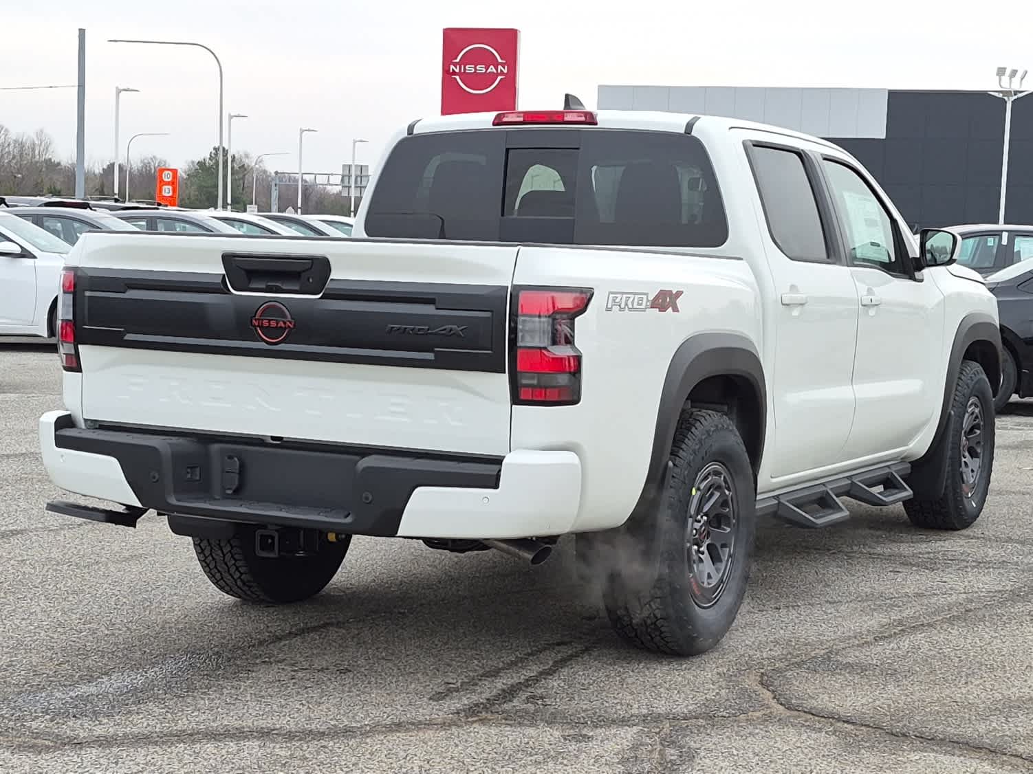 2026 Nissan Frontier PRO-4X - Glacier White exterior view 3