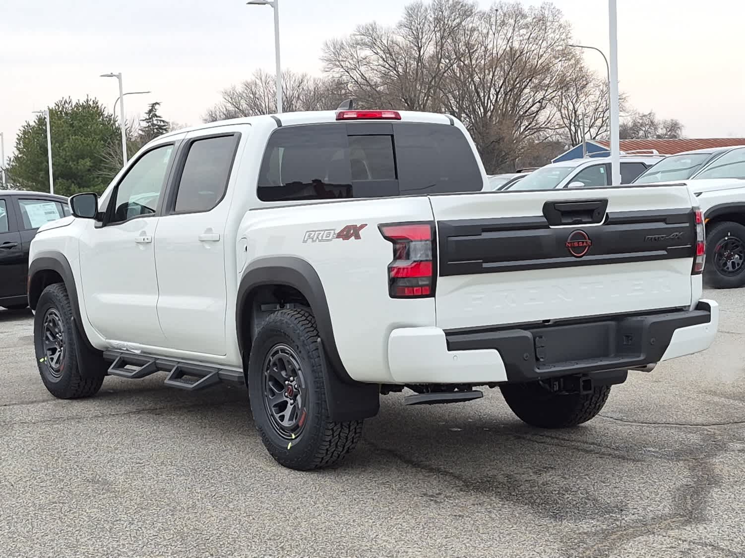 2026 Nissan Frontier PRO-4X - Glacier White exterior view 4