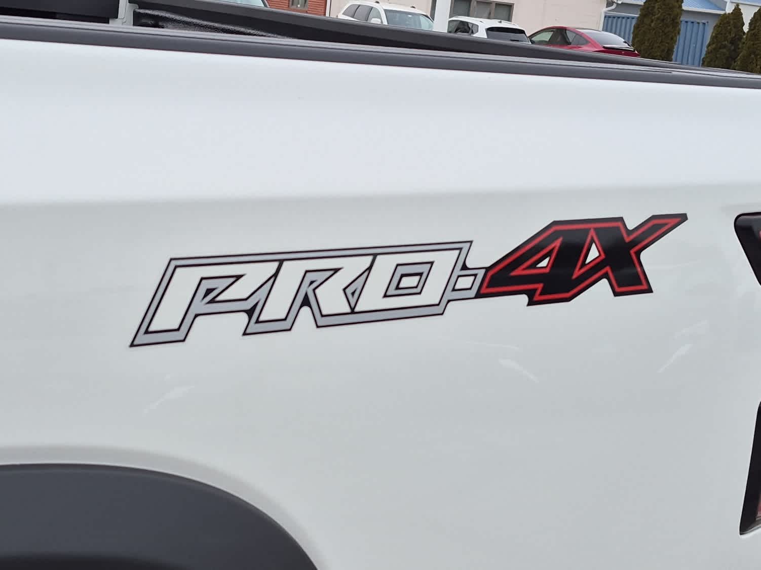 2026 Nissan Frontier PRO-4X - Glacier White exterior view 18
