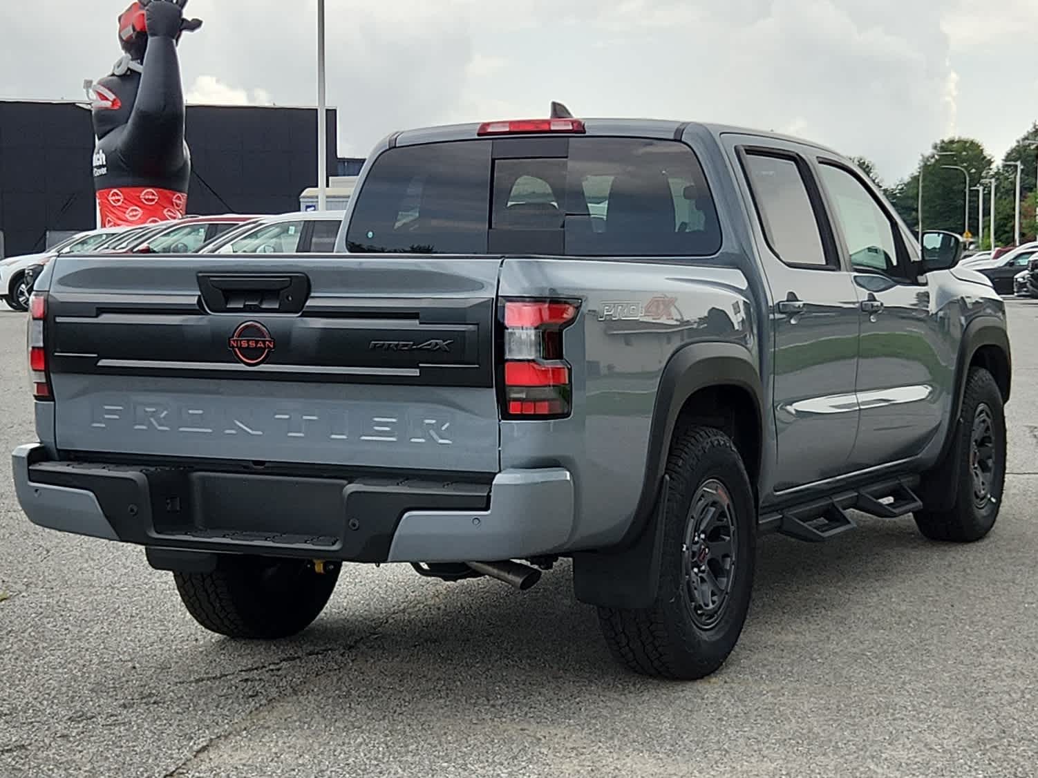 2025 Nissan Frontier PRO-4X - Boulder Gray Pearl exterior view 3