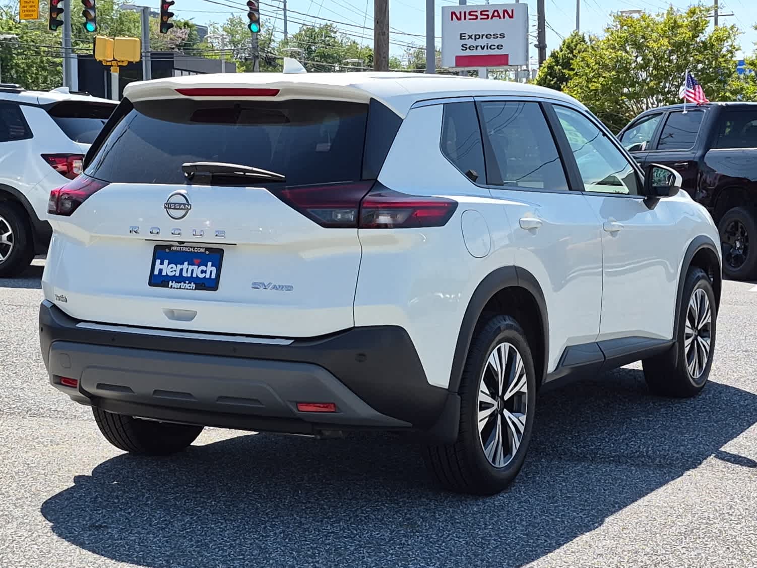 2023 Nissan Rogue SV - Pearl White Tricoat exterior view 3