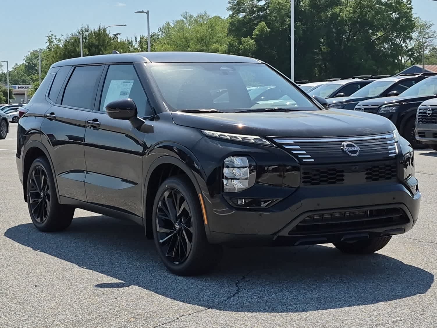 2026 Nissan Rogue Plug-In Hybrid SL - Cosmic Black exterior view 2