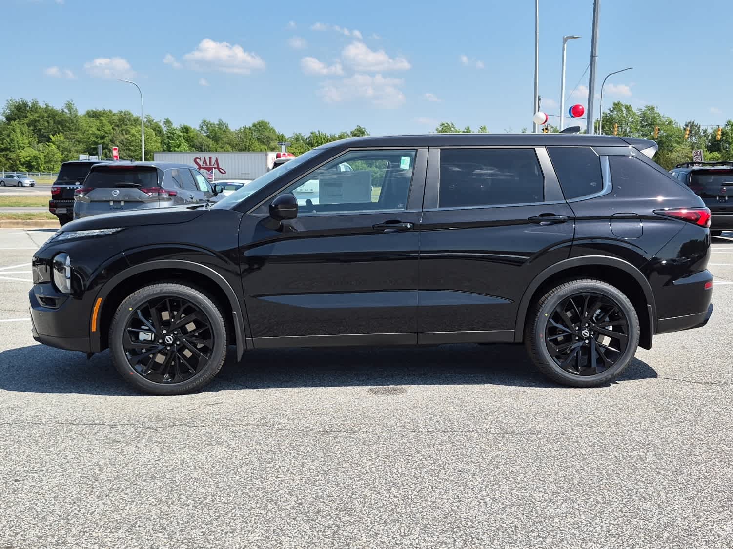 2026 Nissan Rogue Plug-In Hybrid SL - Cosmic Black exterior view 5