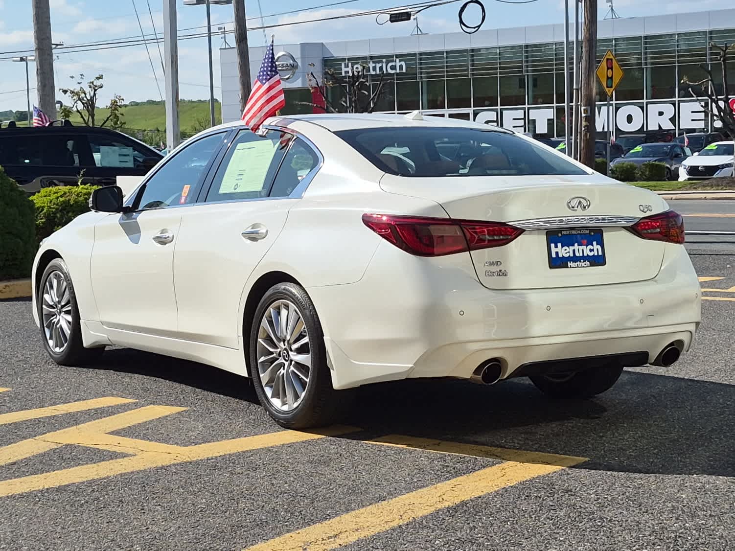 2023 INFINITI Q50 LUXE - Majestic White exterior view 4