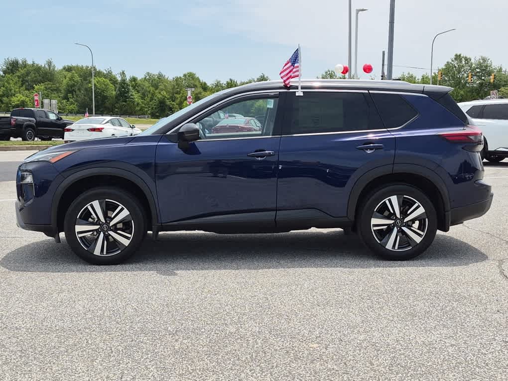 2024 Nissan Rogue SL - Deep Ocean Blue Pearl/Super Black exterior view 5