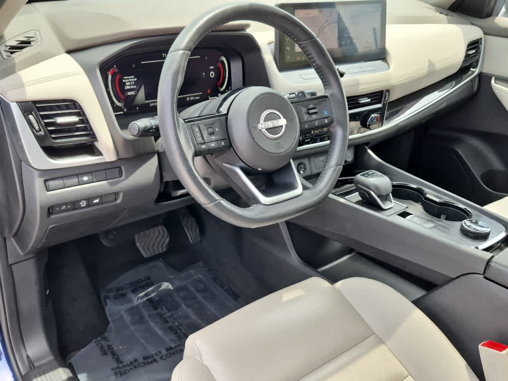 2024 Nissan Rogue SL - Deep Ocean Blue Pearl/Super Black exterior view 12