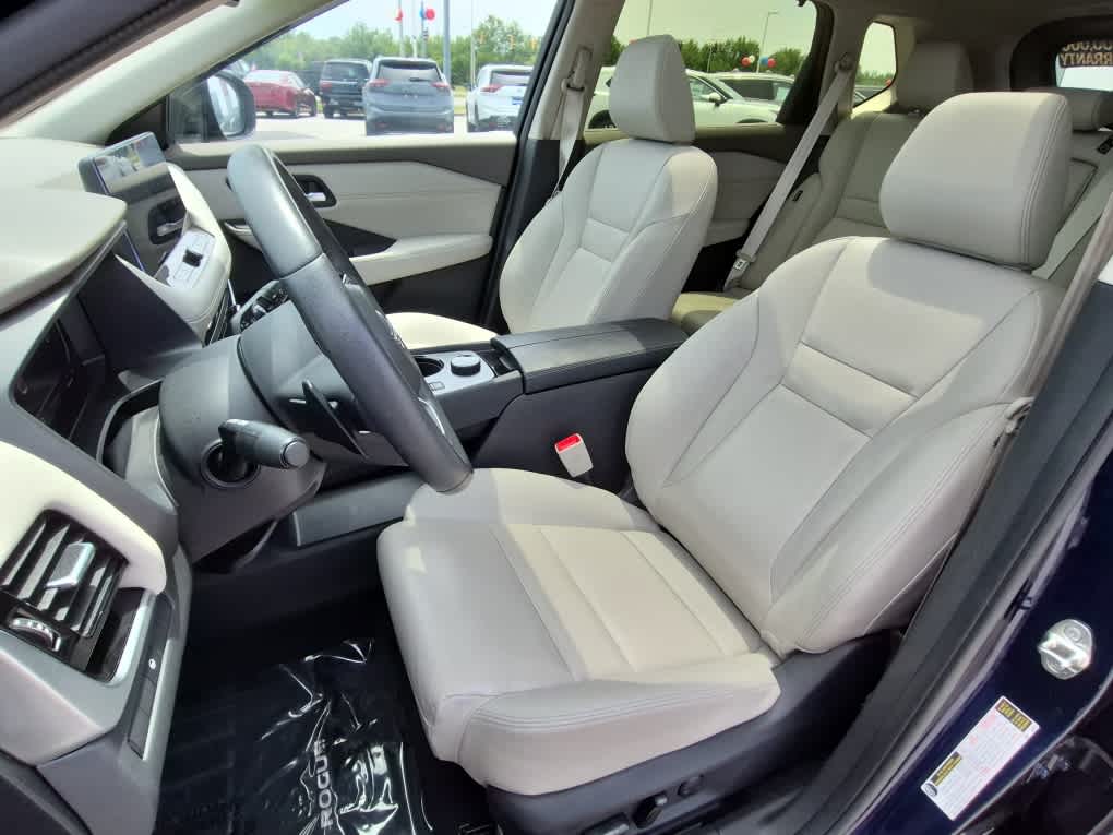 2024 Nissan Rogue SL - Deep Ocean Blue Pearl/Super Black exterior view 11