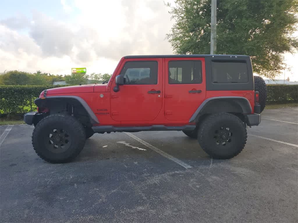 Used 2015 Jeep Wrangler Unlimited Sport with VIN 1C4BJWDG5FL760304 for sale in Florida City, FL