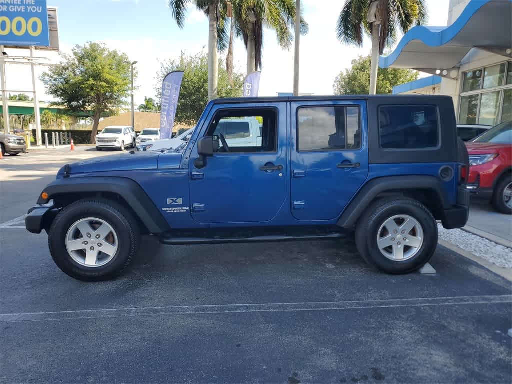 Used 2009 Jeep Wrangler Unlimited X with VIN 1J4GB39149L744650 for sale in Florida City, FL