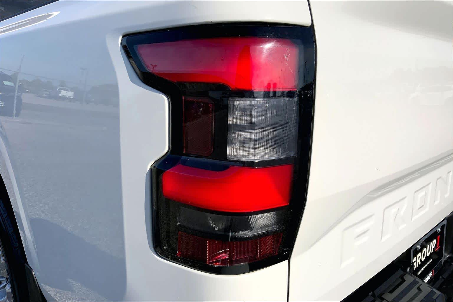 2023 Nissan Frontier SV Glacier White at Sterling McCall Nissan