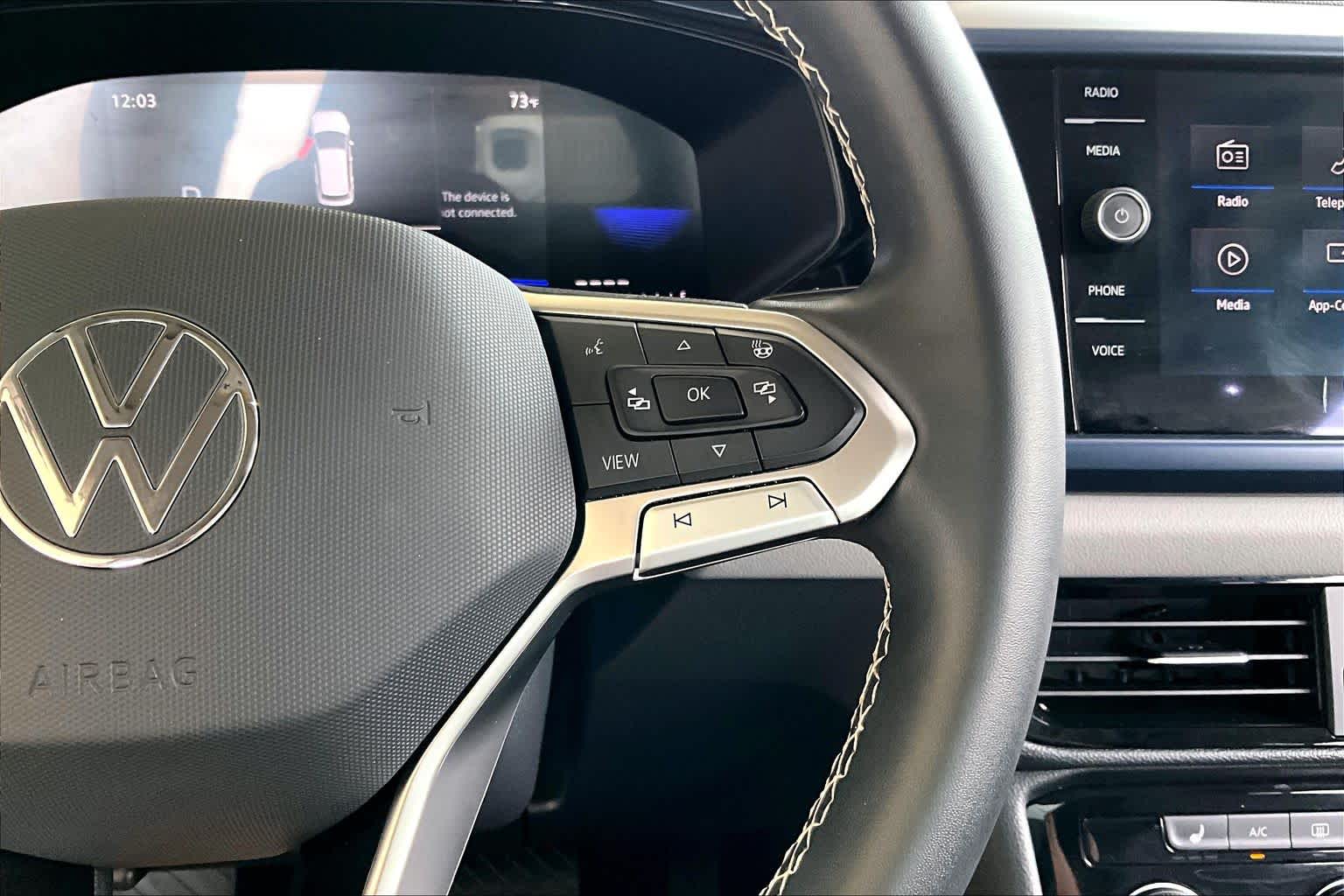 2023 Volkswagen Taos SE Pure Gray w/Black Roof at Westside Kia