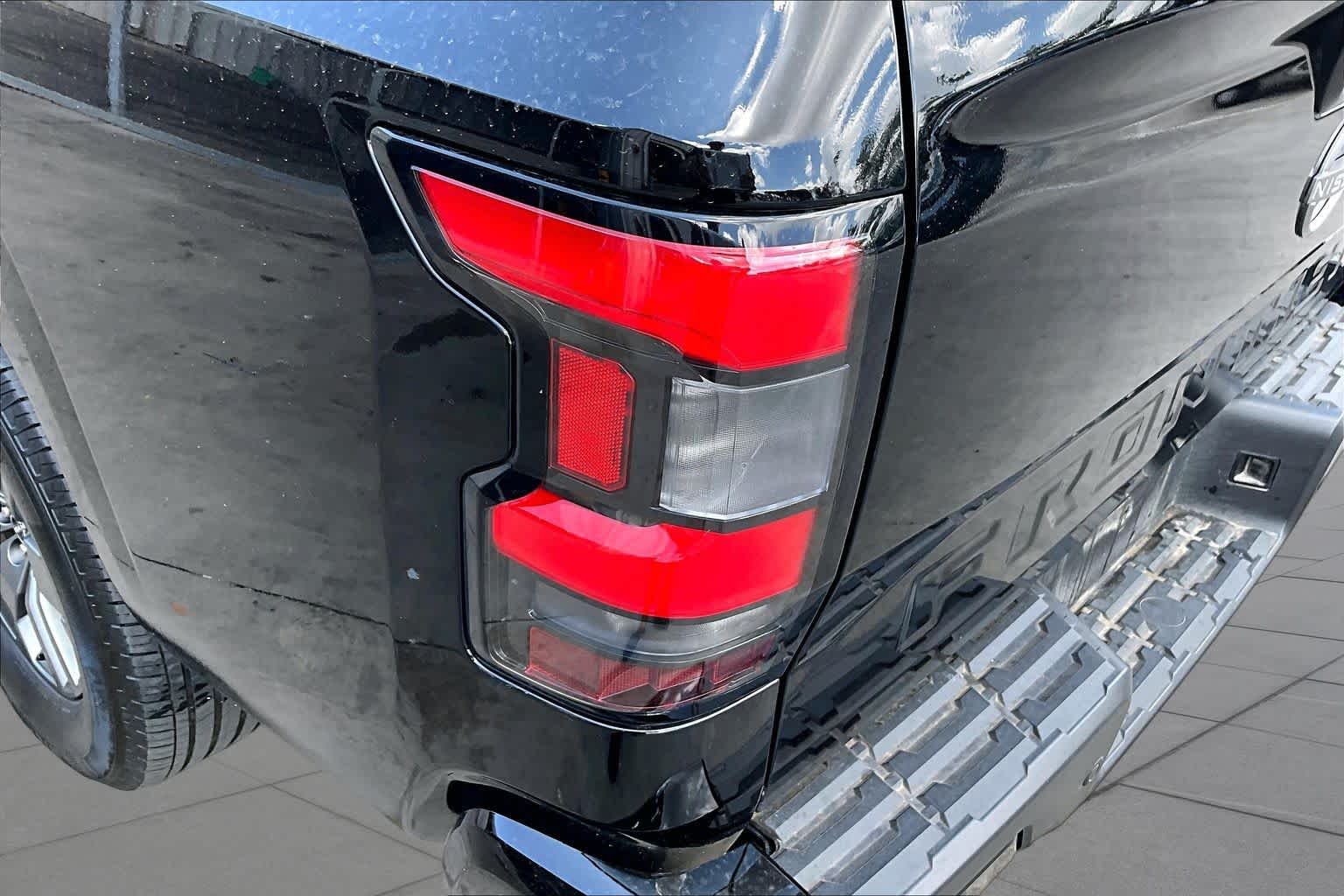 2025 Nissan Frontier SV Super Black at Honda of Clear Lake