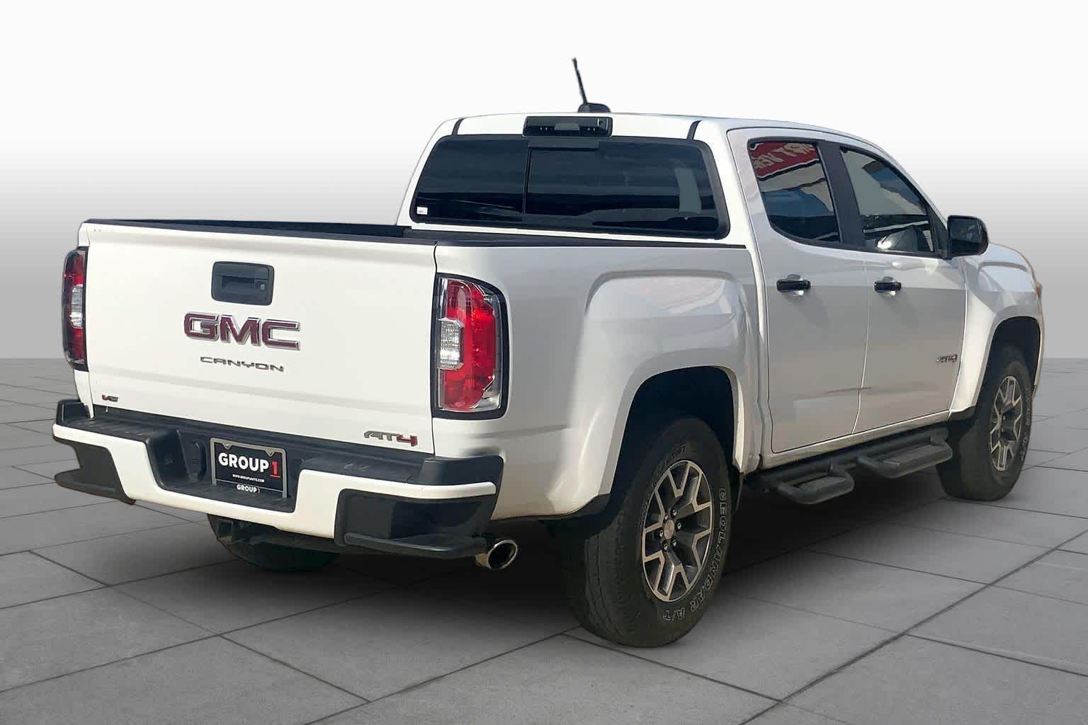 Used 2021 SUMMIT WHITE GMC 4WD AT4 w/Cloth image 13
