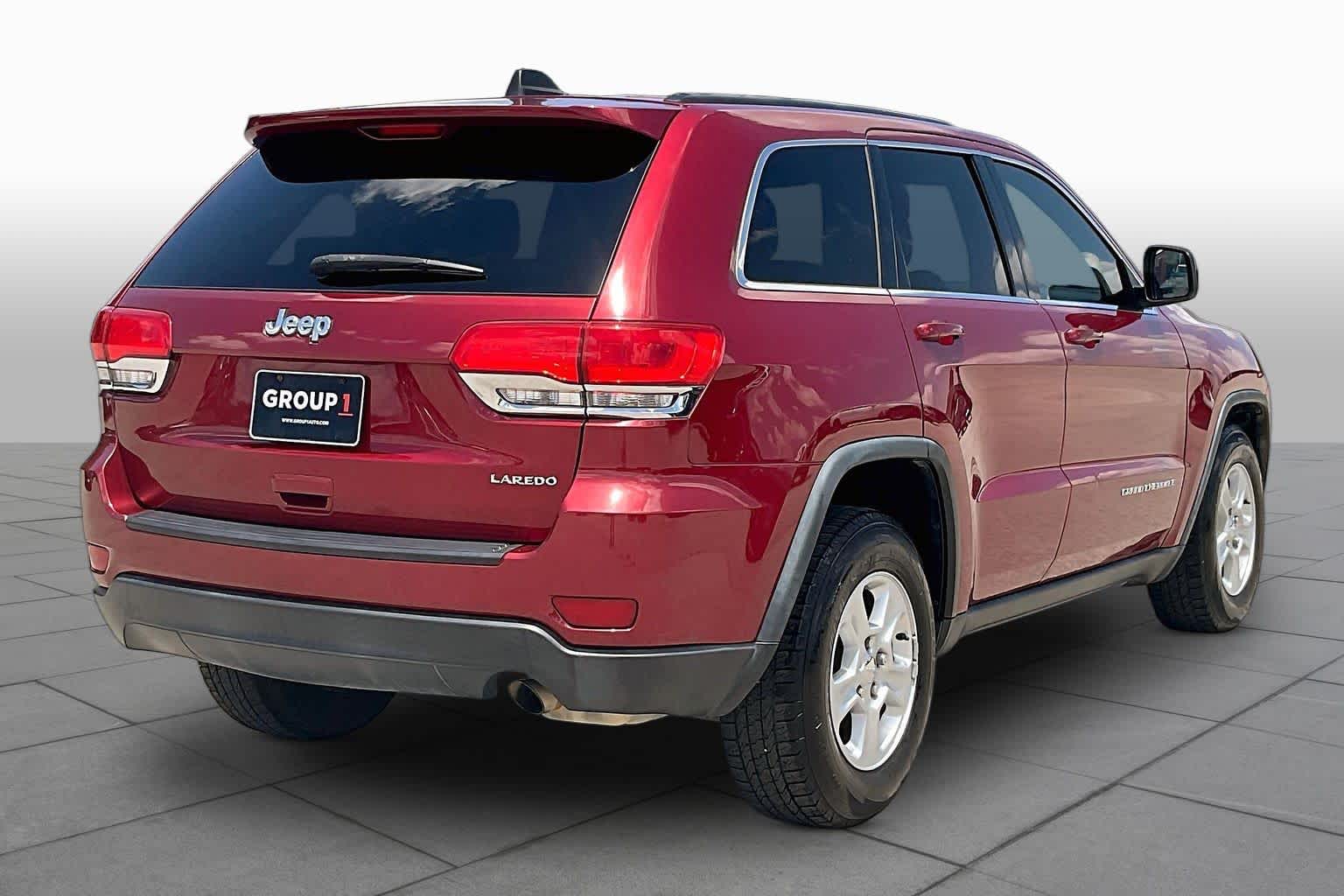 2014 Jeep Grand Cherokee Laredo Deep Cherry Red Crystal Pearlcoat at Sterling McCall Nissan