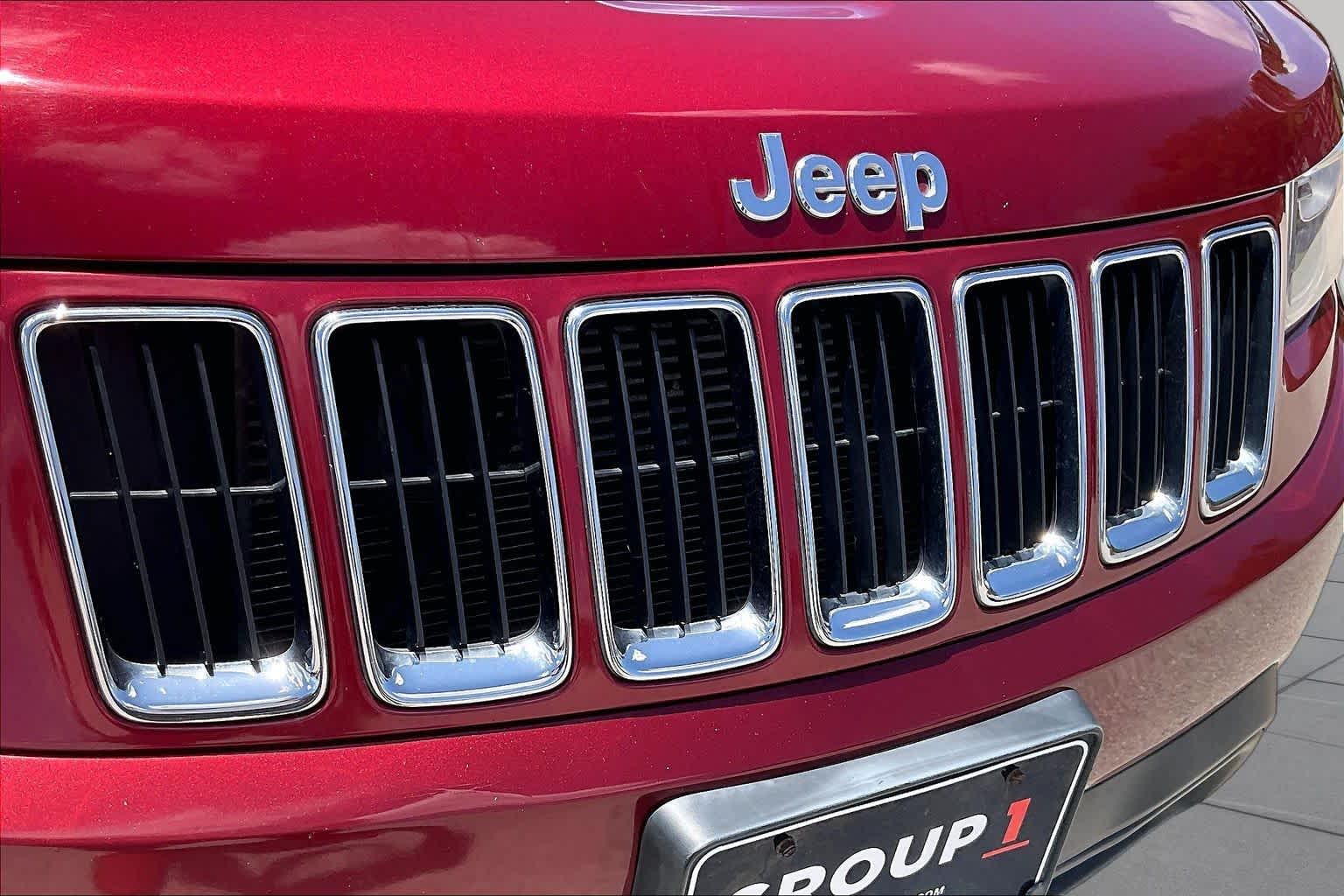 2014 Jeep Grand Cherokee Laredo Deep Cherry Red Crystal Pearlcoat at Sterling McCall Nissan