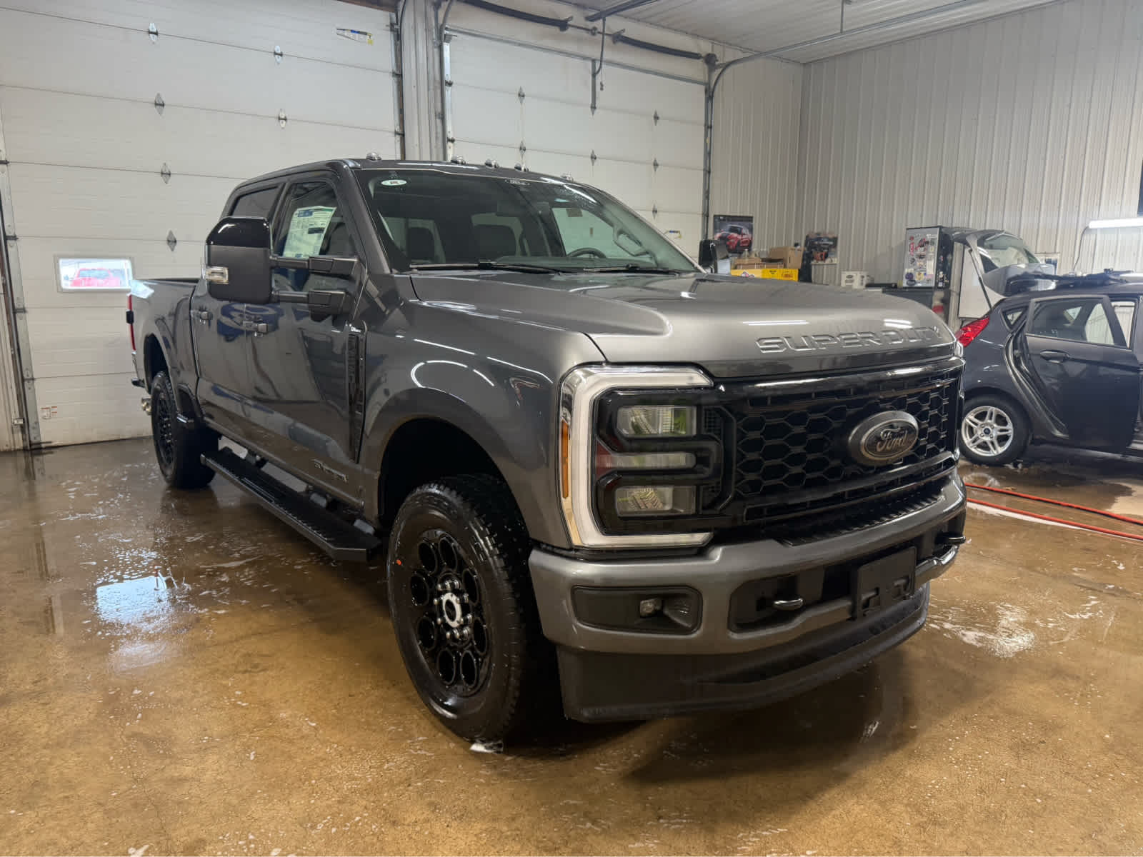 2026 Ford Super Duty F-250 SRW LARIAT - Carbonized Gray Metallic exterior view 2