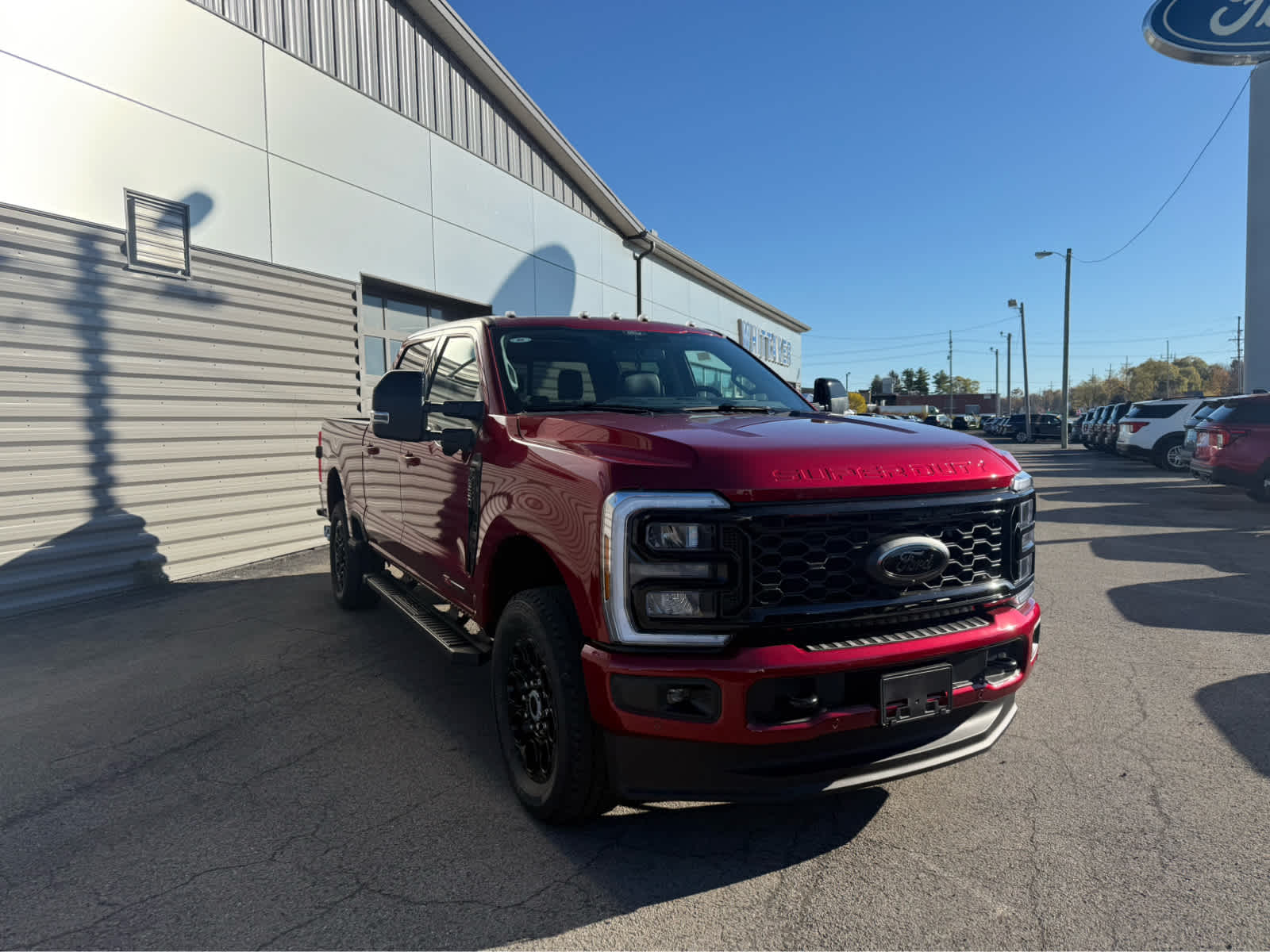 2026 Ford Super Duty F-350 SRW LARIAT - Ruby Red Metallic Tinted Clearcoat exterior view 2
