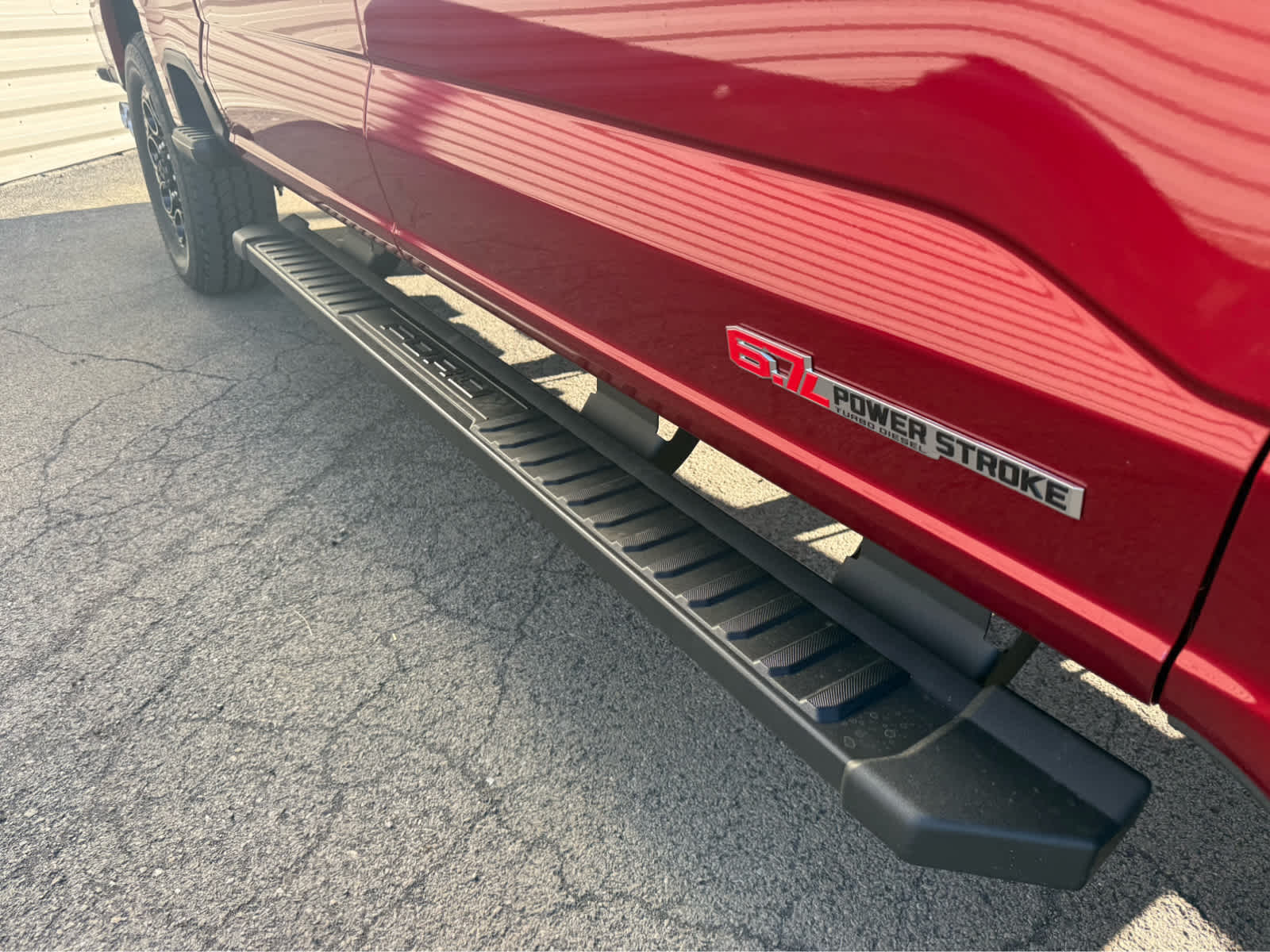 2026 Ford Super Duty F-350 SRW LARIAT - Ruby Red Metallic Tinted Clearcoat exterior view 5