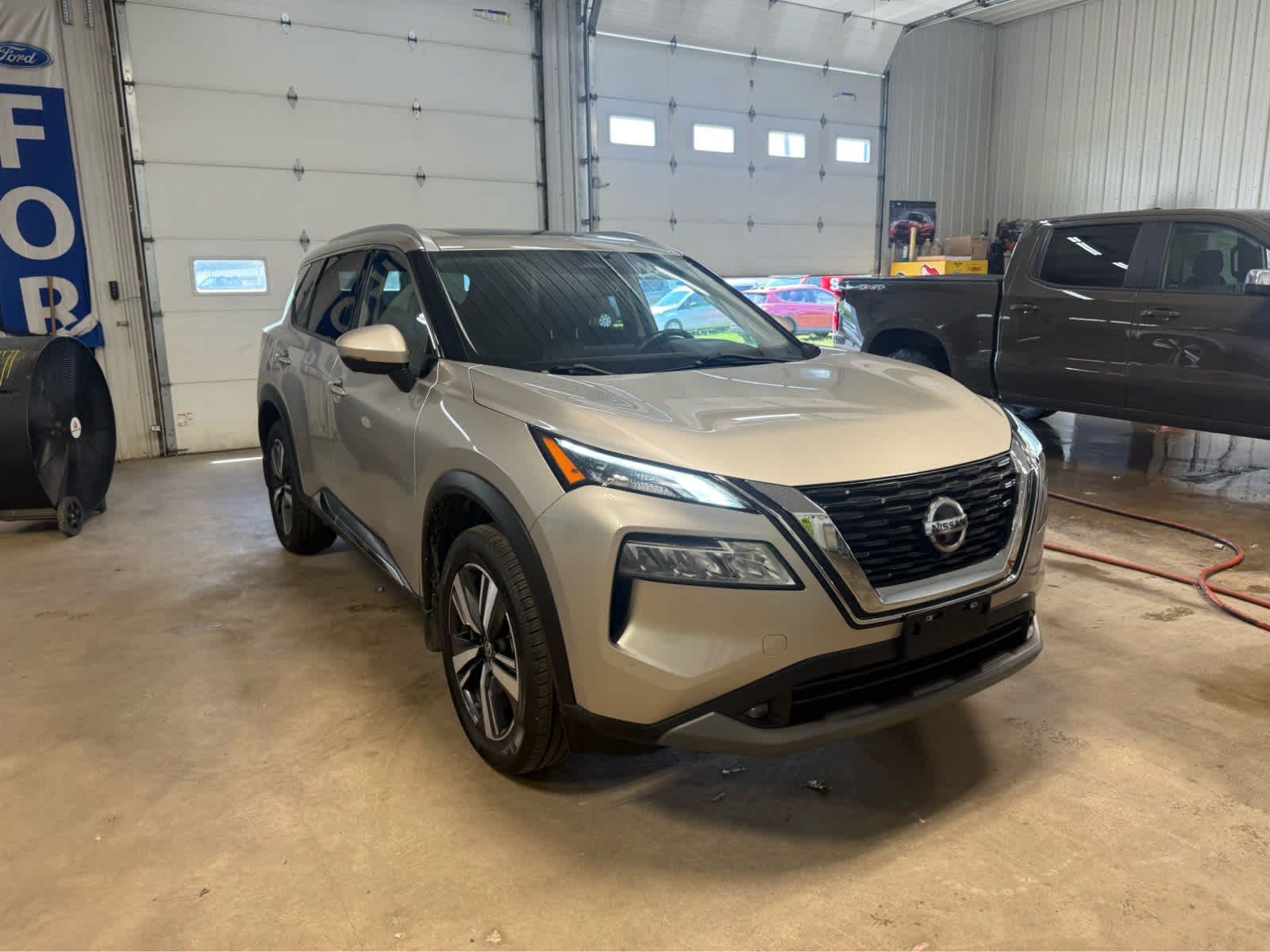 2021 Nissan Rogue SL - Champagne Silver Metallic exterior view 2