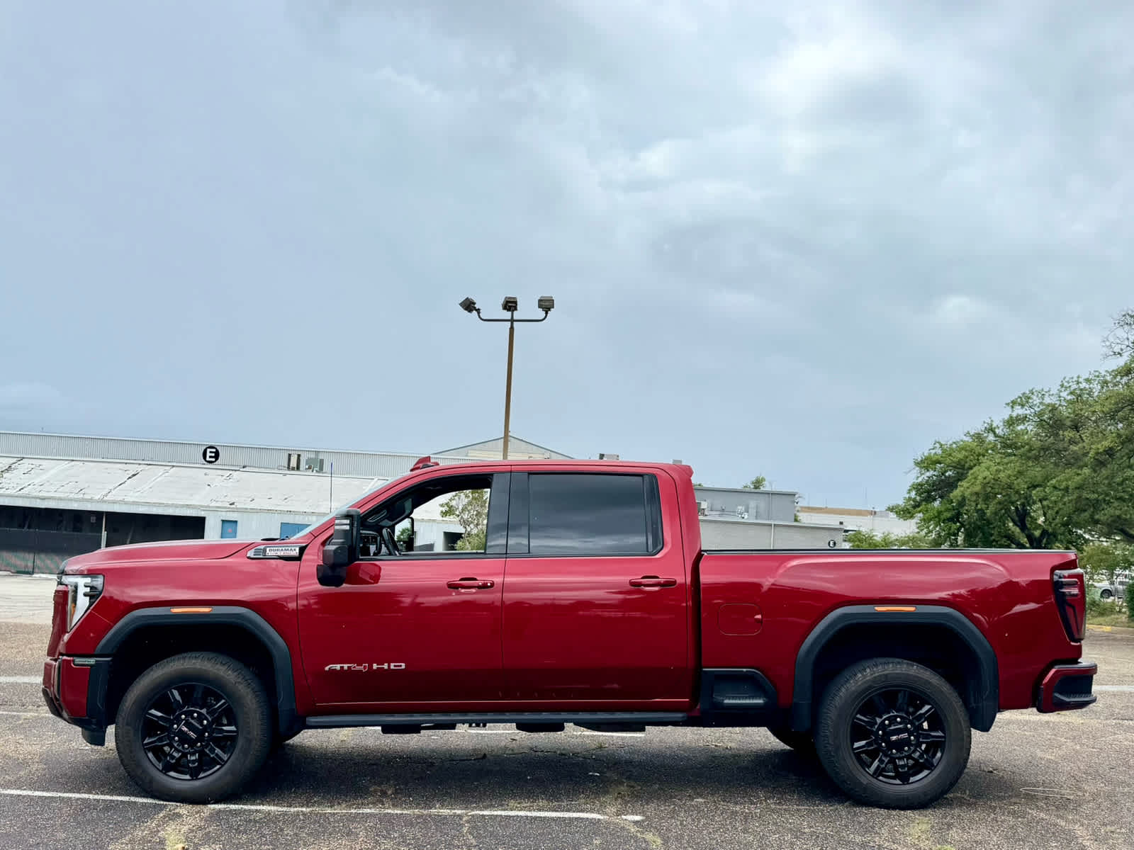Used 2024 Volcanic Red Tintcoat GMC AT4 image 2